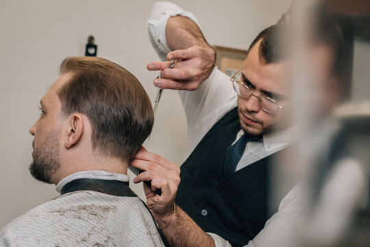Hair cutter cuts hair, small business concept.