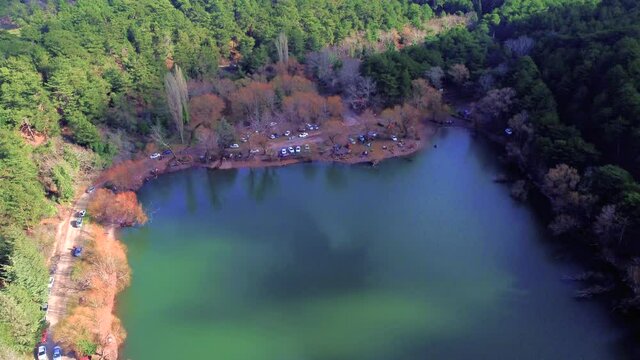 Amazing contrast and view of the Black Lake among colorful forest. Greenery mountains, trees, blue sky reflection and Karagol, Izmir, Turkey.