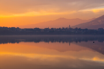 Dramatic Fire red clouds drift across a twilight sky just after sunset