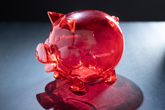 Helsinki / Finland - DECEMBER 30, 2021: A red piggy bank with the logo of Nordea printed on the side. Nordea is a European financial services group operating in northern Europe and based in Helsinki.
