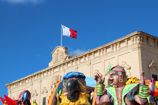 baroque building (auberge de castille) and carnival tanks in valletta in malta 