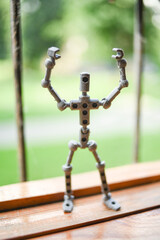 Naklejka premium Stop-motion skeleton for animation, action figure with hands up, robot in action