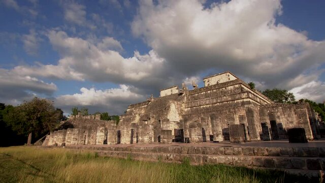 Timelapse of temple of the Warriors (Templo de los Guerreros) exterior in Chichen Itza, Mexico. It's a complex consists of large stepped pyramid fronted and flanked by rows of carved columns 