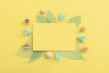 Top view image of forest natural composition over yellow background .Flat lay