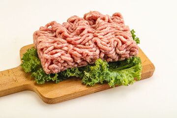 Raw pork minced meat over board