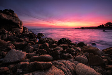 Sunrise over the rocky coast of Pacific Grove, CA.  Monterey Bay