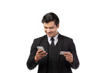 Handsome business man in black suit holding credit card and using smartphone for online shopping isolated on white background. Business, technology, ecommerce and online payment concept.