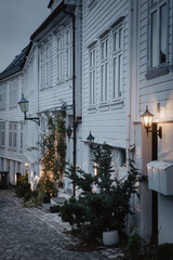 Moody winter time -  white houses on a old town street in Bergen, Norway.