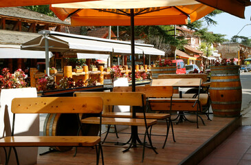 Bar, restaurant. City of Villa General Belgrano, Córdoba, Argentina. Tourist city in the mountains of Cordoba. Oktoberfest venue. National beer festival. 
Tables and chairs of a European German style.