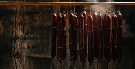 Traditional smokehouse. Traditional food. Smoked sausages meat. Sausages smoke in a smokehouse....