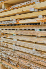 Stacked wood in the sawmill close up