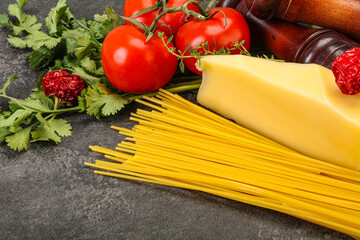 Raw Italian spaghetti heap with cheese