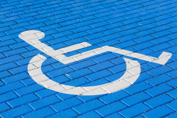 A disabled parking space is marked