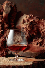 Snifter of brandy on an old dried stump.