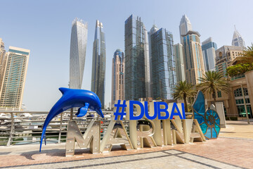 Dubai Marina logo and Harbour skyline architecture wealth luxury travel in United Arab Emirates