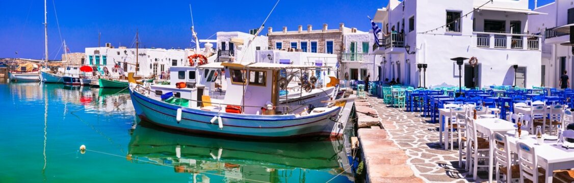 Greece travel. Cyclades, Paros island. Beautiful fishing village Naousa. Panorama of old port with traditioal street taverns