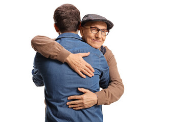 Elderly and young man hugging each other