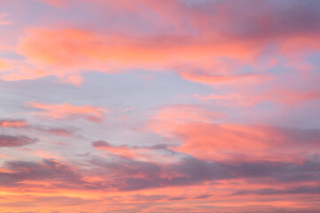 Cloudscape with pink clouds and blue sky. Sunset time, Biarritz, France.