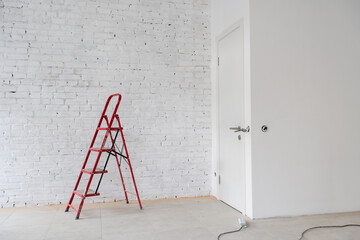 White staircase on a white background with a copy of the space. Minimal style. The concept of motivation, construction and repair.