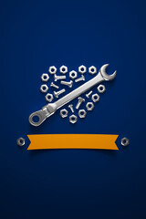 A wrench, screws and bolts laid out in a heart-shaped composition on a dark blue background. 3D render illustration.