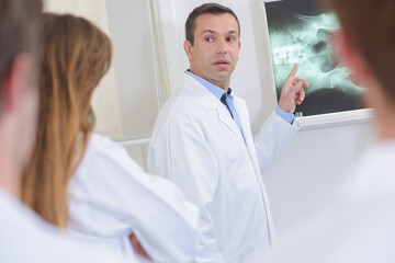 male doctor during a lecture - xray result