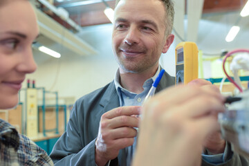 close up of a female electrician measuring voltage