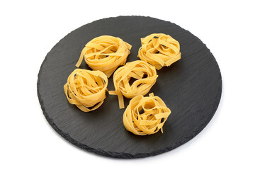 Tagliatelle pasta, isolated on white background.