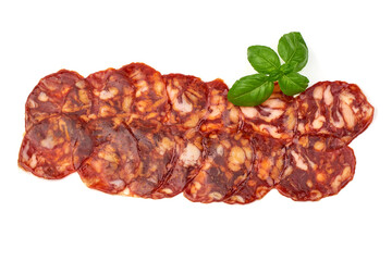 Spanish pork chorizo sausage slices, close-up, isolated on white background.
