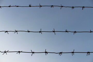 barbed wire against sky