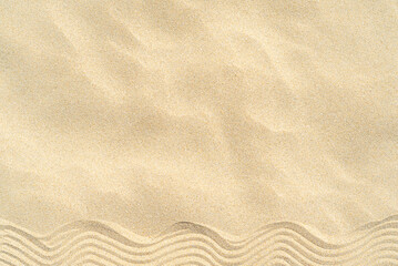 Fototapeta na wymiar Drawing of waves on the sand on the beach, sand pattern