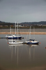Fototapeta na wymiar Boats on the river. United Kingdom, Wales in late winter.