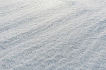 Snow-covered white fields in Alsace, top view. White desert.