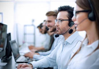 close up.background image of call center employees in the workplace