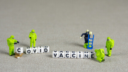 the team of miniature figurines of special doctor forces, making a decision about covid...