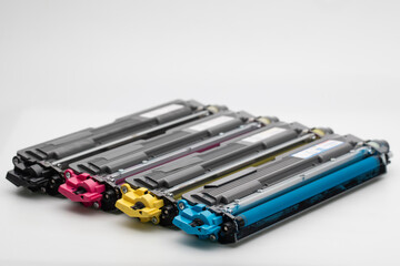Color cartridges for laser printer on white background