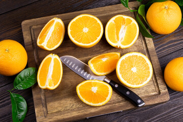 Orange fruits on a wooden background. Healthy food. Vitamins and food. Slice of orange. Selected focus