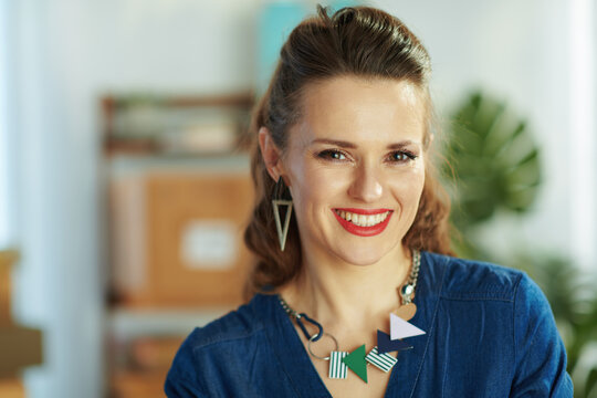 Portrait of happy stylish business owner woman in office