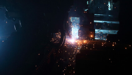 welding robot in the automotive parts industry, The movement of the robot welding in  auto parts factory.
