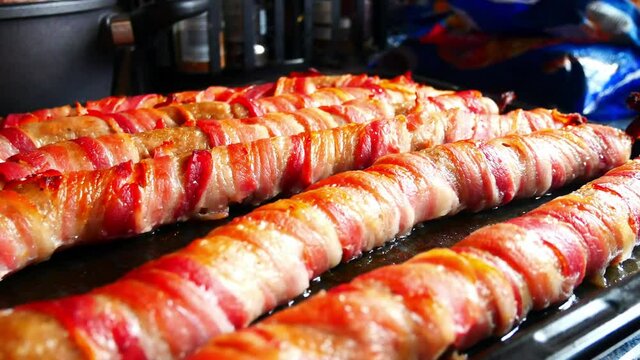 Extra large foot long pigs in blankets traditional bacon wrapped British Christmas homemade party food dolly left