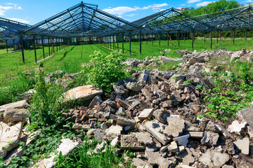 Abandoned greenhouses . Pile of broken bricks