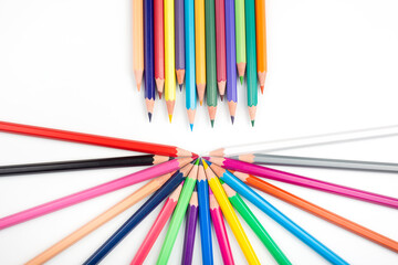 Colored pencils for drawing on a white background. Education and creativity. Leisure and art