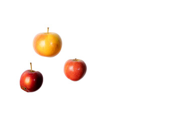 Three flying apples isolated on white background