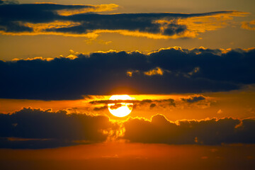 the expressive contrast of the clouds in the sky and sun. The nature and beauty of clouds