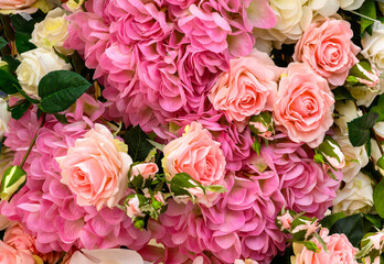 Rose and hydrangea flowers, top view of large bouquet of artificial flowers