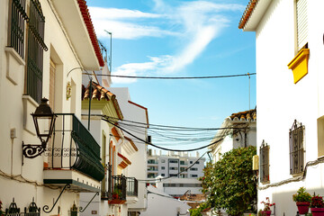 A typical street in old city Estepona with colorful flower pots. Estepona, Andalusia, Spain