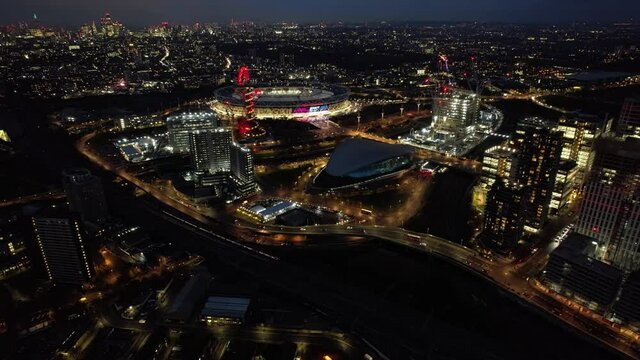 Beautiful City lights at night in downtown London, England - Aerial