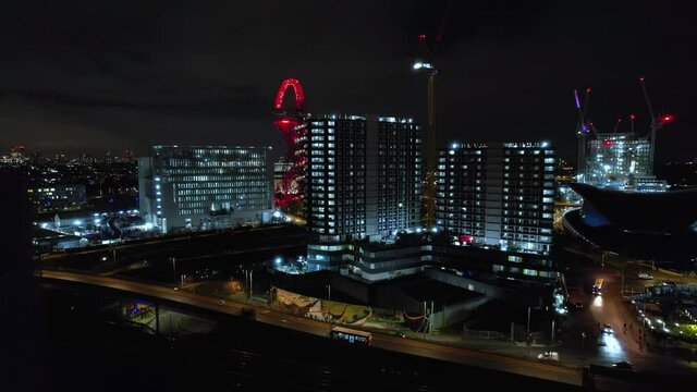 Downtown City Buildings in London, England at Night - Aerial establishing View