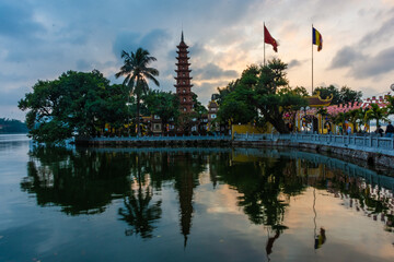 HANOI, VIETNAM, 4 JANUARY 2020: Beautiful sunset over the Tran Quoc Pagoda of Hanoi