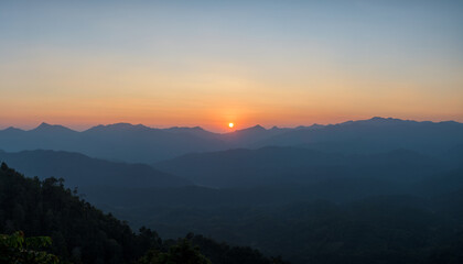 Panoramic beautiful sunset landscape from the forest in the national park on top mountain.