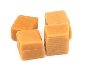 Caramel candies isolated on white background